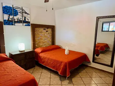 Cama o camas de una habitación en Hotel Sta Cruz Oaxtepec