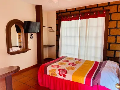 Cama o camas de una habitación en Hotel Sta Cruz Oaxtepec