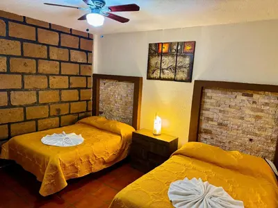 Cama o camas de una habitación en Hotel Sta Cruz Oaxtepec