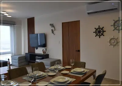 Una televisión o centro de entretenimiento en Suite Ballena Hermoso alojamiento Familiar