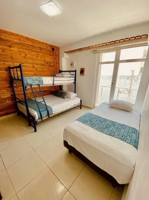 Cama o camas de una habitación en Frente playa equipado con alberca