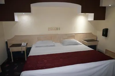 Cama o camas de una habitación en Hotel Rio Inn