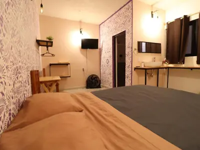 Una televisión o centro de entretenimiento en Casa Corazon Centro