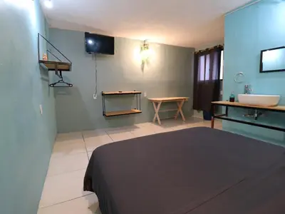 Una televisión o centro de entretenimiento en Casa Corazon Centro