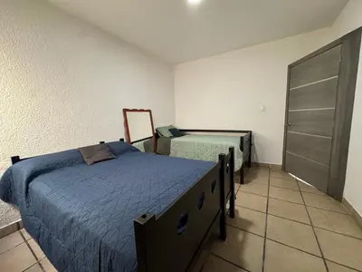Cama o camas de una habitación en Casa contemporánea a pasos de galerías y averanda