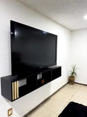 Una televisión o centro de entretenimiento en Alojamiento CARLO Y ABRIL