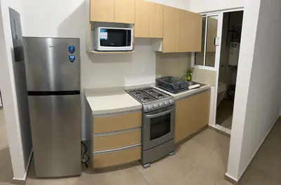 Una cocina o zona de cocina en Departamento tiempo de relax