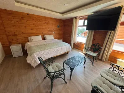 Cama o camas de una habitación en Hotel Cabaña iilldaa