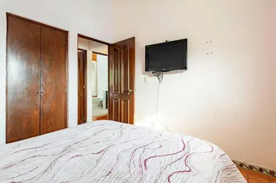 Una televisión o centro de entretenimiento en Casa de descanso con alberca en burgos Cuernavaca