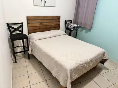 Cama o camas de una habitación en Departamento de las flores