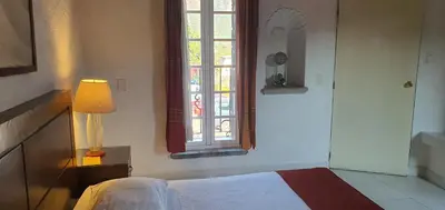 Cama o camas de una habitación en Hotel Casa Piñón