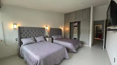 Cama o camas de una habitación en Casa amueblada dentro de club de golf