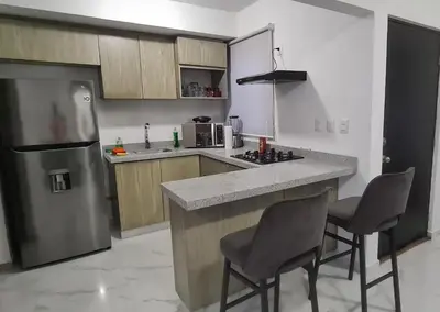 Una cocina o zona de cocina en Departamento Moderno y Cómodo