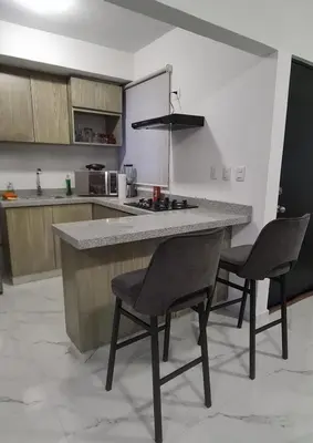 Una cocina o zona de cocina en Departamento Moderno y Cómodo