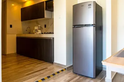Una cocina o zona de cocina en Cozy Apartment 2 Bedrooms Amenities