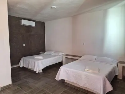 Cama o camas de una habitación en la Playita