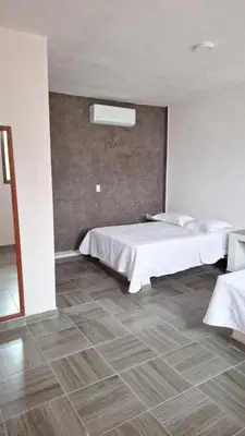Cama o camas de una habitación en La Playita