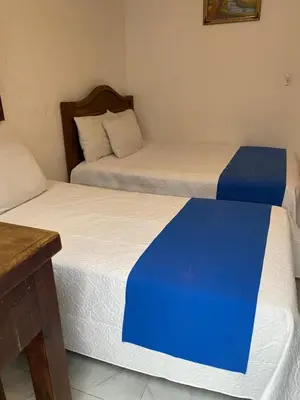 Cama o camas de una habitación en Hotel Nacional
