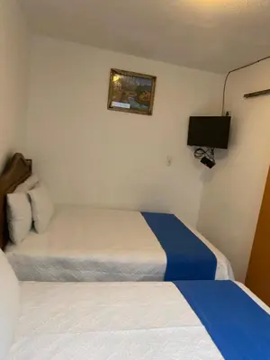 Cama o camas de una habitación en Hotel Nacional