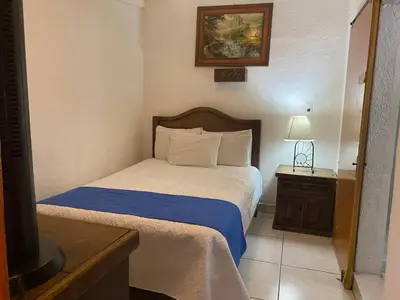 Cama o camas de una habitación en Hotel Nacional