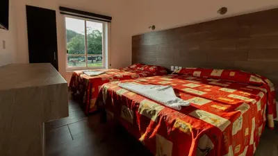 Cama o camas de una habitación en Hotel Galería del Ángel