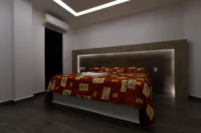 Cama o camas de una habitación en Hotel Galería del Ángel