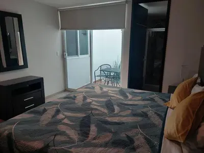 Cama o camas de una habitación en Departamento en Cholula Pue La Lunita C1