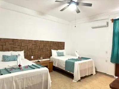 Cama o camas de una habitación en Hotel Acapulco Club Diamante