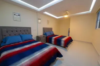 Cama o camas de una habitación en Departamento a 2 minutos de la playa