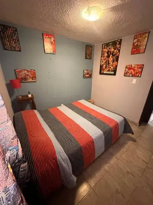 Cama o camas de una habitación en Departamento hogareño Teziutlán