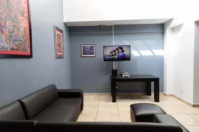 Una televisión o centro de entretenimiento en Family House with 4 Bedrooms Oaxaca