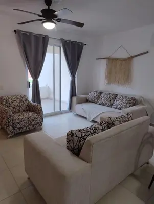 Zona de estar de Hermosa Villa con recamara en PB