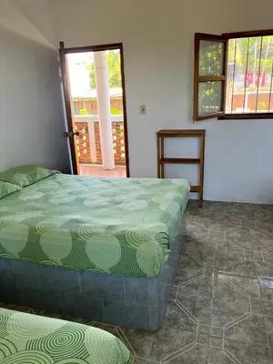 Cama o camas de una habitación en Cabañas Edda