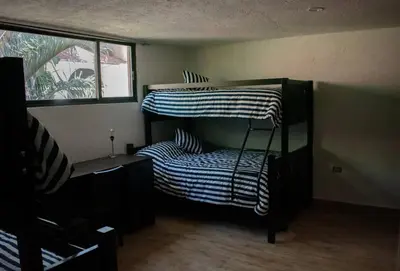 Cama o camas de una habitación en Casa Atlixco con alberca