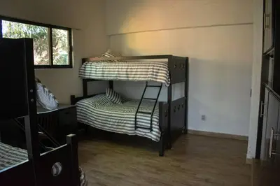 Cama o camas de una habitación en Casa Atlixco con alberca
