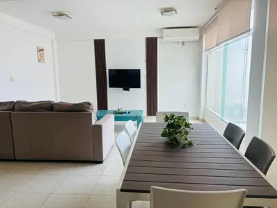 Una televisión o centro de entretenimiento en Depa con alberca a 2 minutos Playa Vicente Fox 1