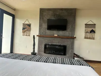 Una televisión o centro de entretenimiento en Casa Madera 1A