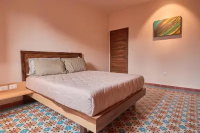 Cama o camas de una habitación en Rojo Diseno Ubicacion Confort y AC