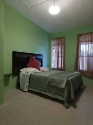 Cama o camas de una habitación en Casa León