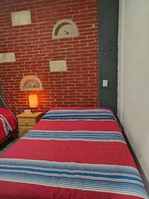 Cama o camas de una habitación en Casa Alianza Jalatlaco