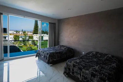 Cama o camas de una habitación en Hermosa Quinta Arcangeles