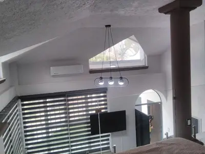 Una televisión o centro de entretenimiento en Casa Bugambilias