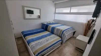Cama o camas de una habitación en Alojamiento armandos le club piso 20