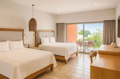 Cama o camas de una habitación en Condos Privados en Huatulco