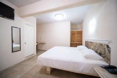Cama o camas de una habitación en HOTEL PENÍNSULA Salina Cruz