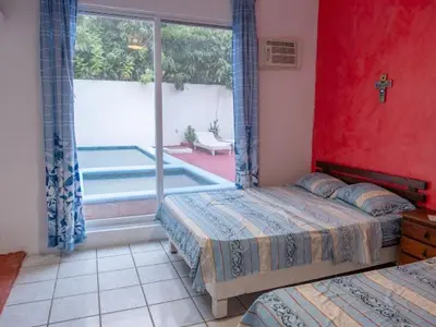 Cama o camas de una habitación en Casa de la abuela costeña