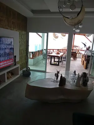 Una televisión o centro de entretenimiento en Casa Rubi