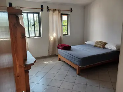 Cama o camas de una habitación en Casa con alberca y jardin en parres jiutepex