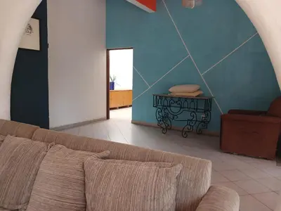 Zona de estar de Casa con alberca y jardin en parres jiutepex