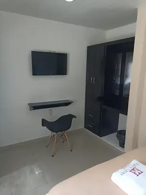 Una televisión o centro de entretenimiento en Hotel Ejecutivo Express Paraiso